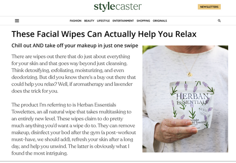 Herban Essentials facial wipes being held by a person on StyleCaster website