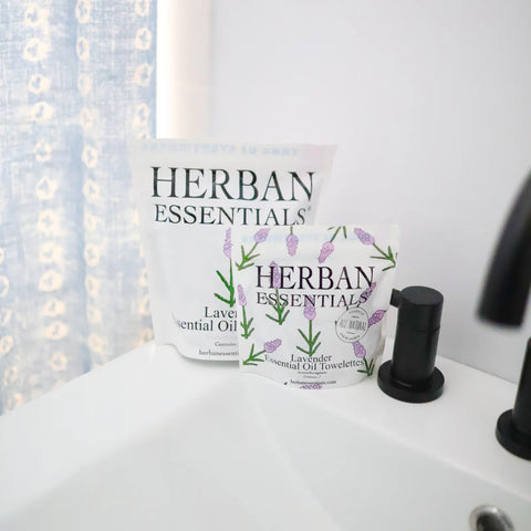 Herban Essentials lavender essential oil products on a sink