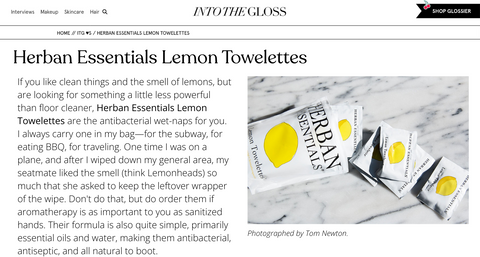 Into The Gloss feature highlighting Herban Essentials Lemon Towelettes for subway, BBQ, and travel days
