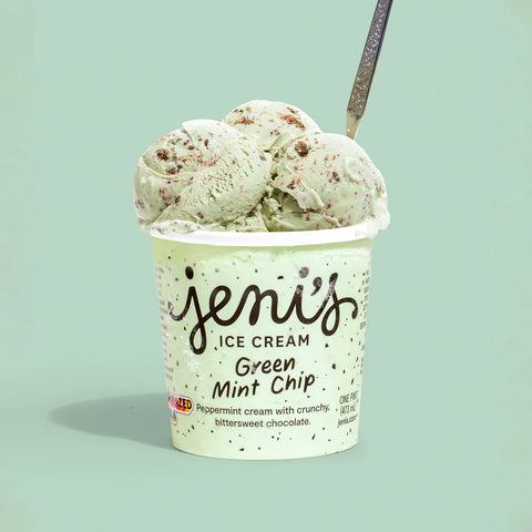 Bowl of Jeni’s Green Mint Chip ice cream with fresh mint sprig—silky peppermint flavor from essential oil and natural green hue for a sensory reset.